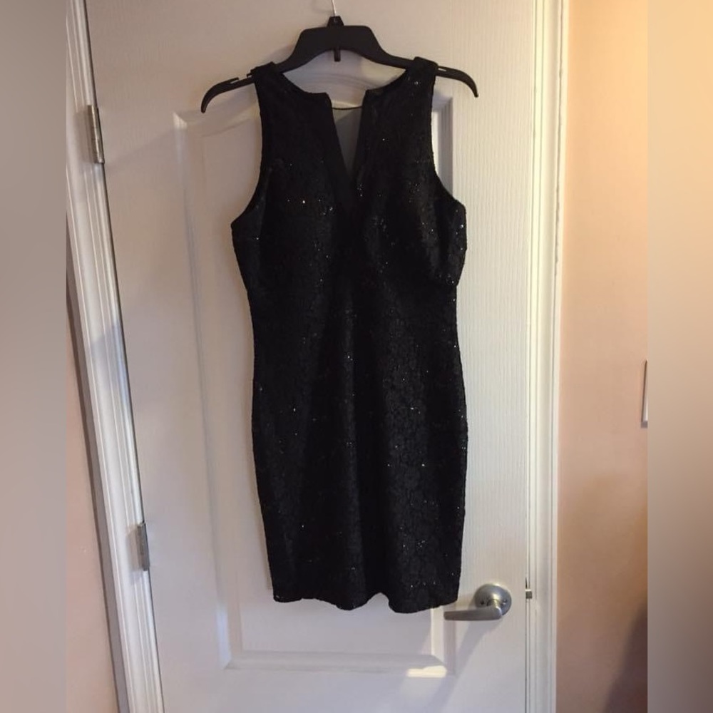 Little black party dress. Definitely for a wedding or fancy party. Size 10P